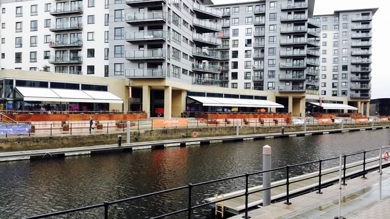 Wide view of commercial retractable awnings for Leeds Dock 3